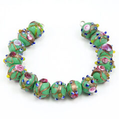 Bead, Venetian 10mm Opaque Green Round with Gold Banding and Rose Pattern, holesize: 2mm