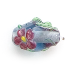 Bead, Lampwork Glass, 16x10mm Oval shape with a raised Flower Design on Light Sapphire color bead (Hole Size 2.25mm)