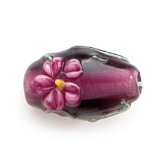Bead, Lampwork Glass, 16x10mm Oval shape with a raised Flower Design on Amethyst color bead (Hole Size 2.25mm)